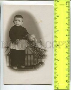 433537 Russia 1960 year boy with a doll in a strollerl photo