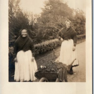 c1910s Outdoor Women Wheebarrow RPPC Laughing Smile Gardening Farm Photo PC A212