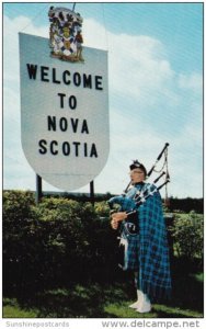 Canada Piper At Welcome Sign Nova Scotia