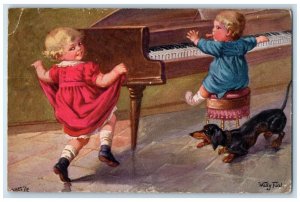 c1910's Little Boy Playing Piano Dancing Daschund Dog Oilette Tuck's Postcard