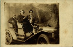 RPPC Men in Early Antique Car Studio Prop Backdrop Real Photo Postcard 