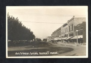 RPPC RUPERT IDAHO DOWNTOWN STREET SCENE OLD CARS STORES REAL PHOTO POSTCARD