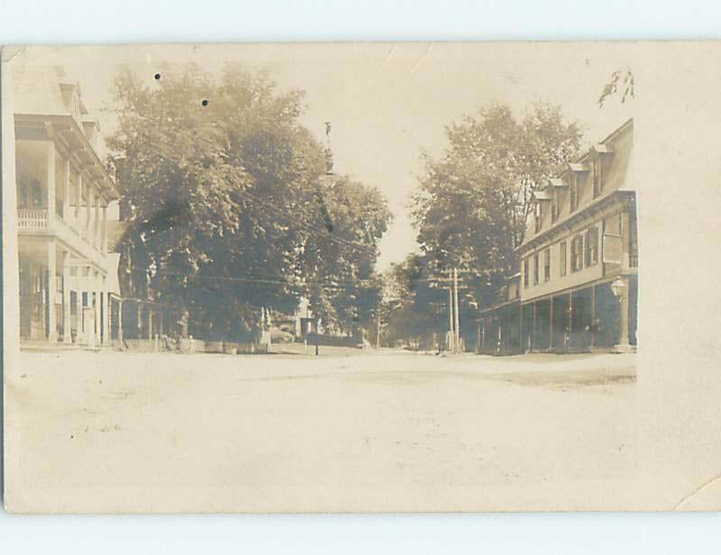 c1910 rppc SHOPS AND BUILDINGS ALONG STREET IN UNKNOWN TOWN HM0487