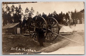 RPPC Logging Camp C.L. Vaughan Logger with Set of Big Wheels Postcard J21