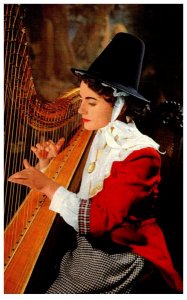 Welsh Woman playing Harp in national costume