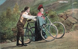 UPHILL WORK-MAN & WOMAN RIDING BICYCLES~BRITISH ROMANCE POSTCARD