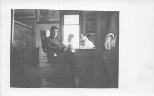 H97/ Waukee Wisconsin RPPC Postcard c1910 Man and Dog Office Interior  132