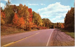 postcard Wisconsin - Greetings - St. Germain, Wis - foliage on roadway