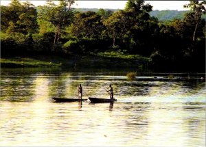 Zambia, Africa  ZAMBEZI RIVER  Men Paddling Boats Upstream   4X6 Postcard