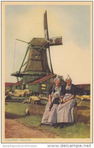 Netherlands Volendam Locals in Traditional Costume with Windmill