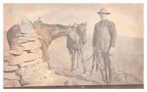Farmer  fence repair, on Horseback  , RPPC