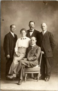 RPPC Men Balding Head Family Portrait Woman Center c1910 Real Photo Postcard U14