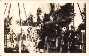 Uniformed Men @ Work~Equiment Haning from Chain~Construction~c1920 RPPC-Postcard