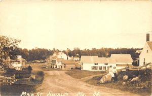 Shirley ME Dirt Main Street View Women on Rock in 1916 RPPC Postcard