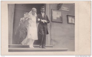 RP; Newlyweds exiting building, 1950s