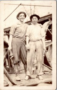 postcard RPPC - Two Working Men in hats water wheel? Mill?  AZO 1910-1930