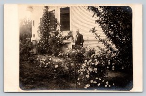 RPPC Man & Woman Enjoying Flowers by Home ARTURA 1910-1924 VINTAGE Postcard 1333