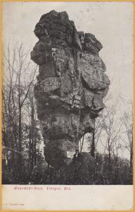 Viroqua, Wis., Monument Rock with graffiti & advertising, man out front - 1908