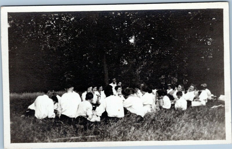 rppc Large group of people sitting in field forest Velox 1907-1914