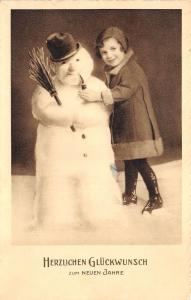 BG20673 child with snowman smoking new year neujahr   germany