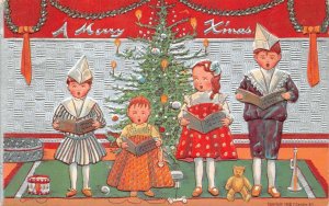 CHRISTMAS HOLIDAY CHILDREN SINGING TEDDY BEAR EMBOSSED POSTCARD 1911