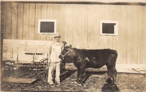 H90/ Interesting RPPC Postcard c1910 Farmer Cow Wagon Farming 183