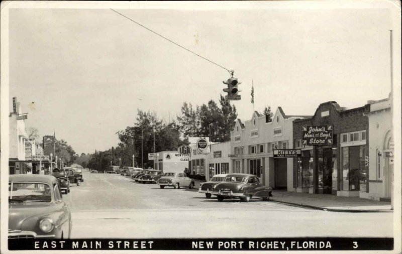 New Port Rochey FL Florida East Main St. Real Photo Postcard STORE SIGNS
