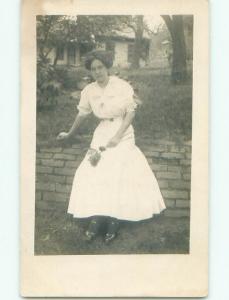 Pre-1920 rppc PRETTY GIRL SITS ON WALL Postmarked Peru - Near Auburn NE i8417