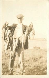 1920s Fishing Man Large String of Fish RPPC real photo postcard 5896