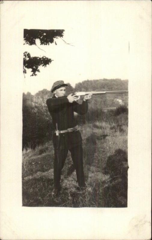 Young Man Aiming Gun Rifle - Knife in Holster c1910 Real Photo Postcard