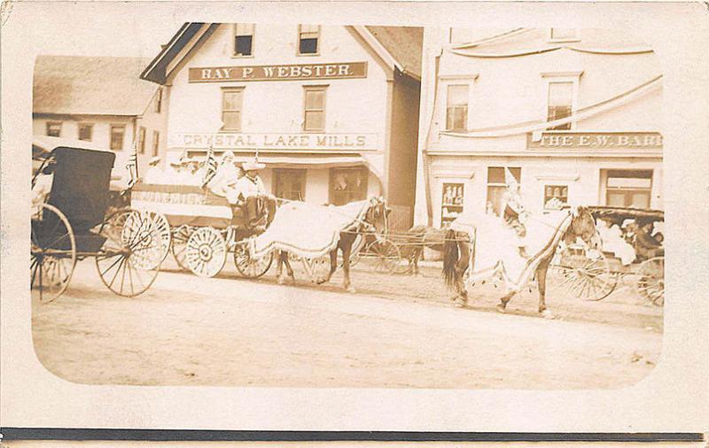 Chrystal Lake NH Store Fronts Horse & Wagons Parade RPPC Postcard