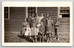 RPPC Rural Schoolhouse Children Class Photo Poor Sad Child No Shoes Postcard U29