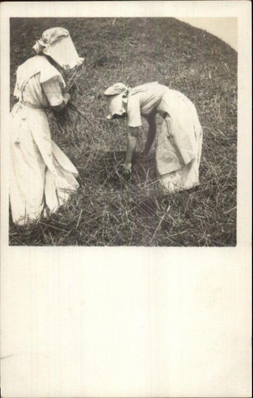 Women in Bonnets Out in Field Gathering Hay or Sticks Amateur RPPC c1910 