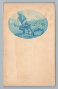 Farmer Bottle Feeding Baby Lamb Sheep Oval Blue RPPC Photo Vintage Postcard 