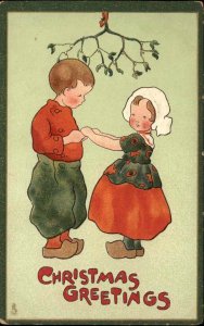 Tuck Dutch Children Christmas Girl and Boy Under Mistletoe c1910 Postcard