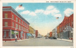 J17/ Miles City Montana Postcard c1920s Main Street Berg Store Autos 44