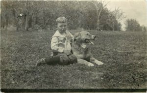 c1910 RPPC Postcard Little Boy Seated on Grass w/ Good Golden Retriever Type Dog