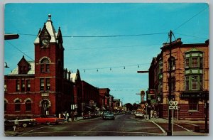 Postcard Gananoque Ontario c1960s King Street Looking East Old Cars Shops Signs