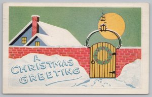 Christmas~Red Brick Wall~Holly Berry Wreath~Top Of House~Vintage Postcard 