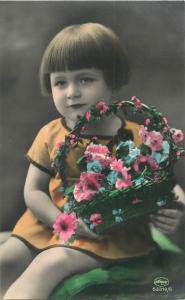 Vintage tinted cute children postcard girl flowers bascket