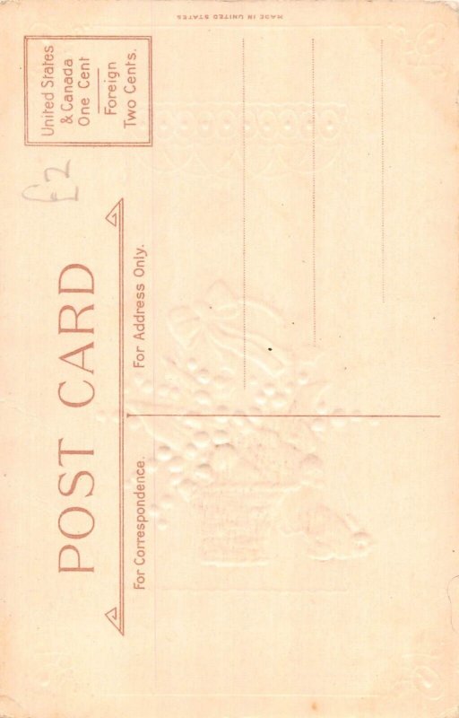 A049 Easter water lilies in basket ribbon chick falling embossed postcard