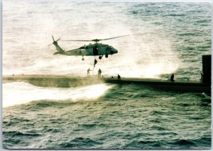 VINTAGE CONTINENTAL SIZE POSTCARD U.S. NAVY SEALS EXERCISE USS HAMPTON SUBMARINE