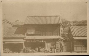 China? Unidentified Building & Barrels c1910 Real Photo Postcard