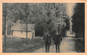 Men walking on dirt path Unused 