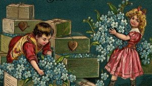 1907-15 Best Wishes Postcard Blue Poinsettias Cute Kids Packing Boxes Embossed  