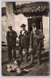 RPPC Hunters Three Old Men Travelers Rifles Dog At Rest House  Postcard AA3