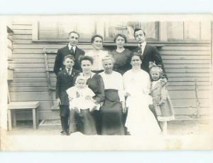 Pre-1920's rppc CUTE GIRL WITH BOW IN HAIR IN GROUP SHOT o2239