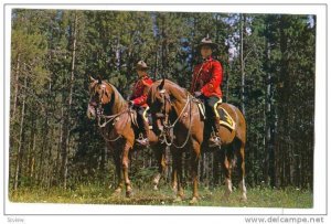 Two members of the Royal Canadian Mounted Police in their striking scarlet un...