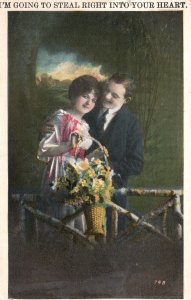 Postcard 1929 I'm Going To Steal Right Into Your Heart! Lovers w/ Flowers Basket
