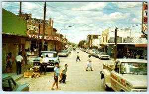 CIUDAD ACUNA, MEXICO  Busy STREET SCENE  ca 1960s Cars & Pickup Trucks  Postcard